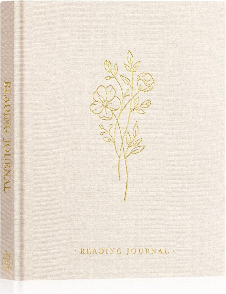 A light gray journal with golden flowers in the center and the words Reading Journal in gold near the bottom.