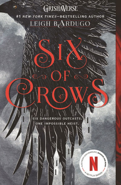 Book cover of "Six of Crows" by Leigh Bardugo. A black crow with spread wings on a gray background with spires from a building skyline appearing in the negative space of the feathers. Red, ornate title text.