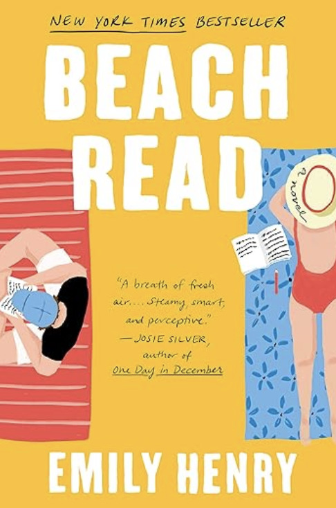 Beach Read by Emily Henry. Illustrated image of two people lying on towels—one reading, the other writing—against bright pink and yellow backgrounds with books and drinks beside them.