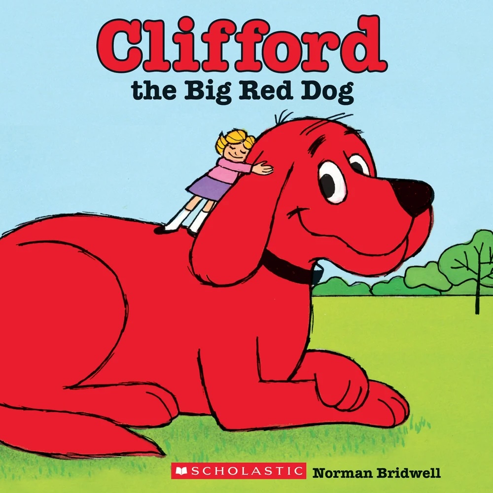 Clifford the Big Red Dog by Norman Bridwell book cover, depicting Clifford lying on a field and being hugged by Emily. In the background is the blue sky and a few trees.