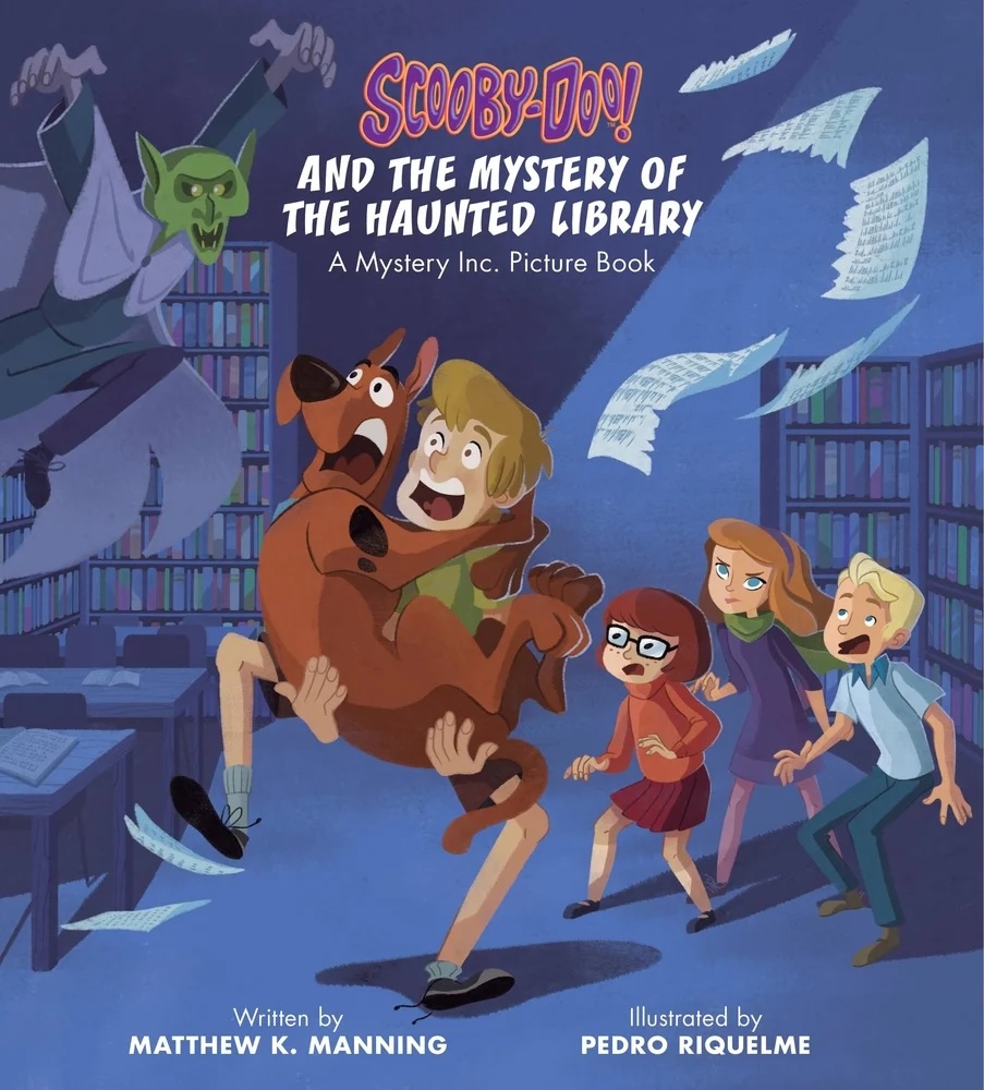 Scooby-Doo and the Mystery of the Haunted Library by Matthew K. Manning book cover, depicting an illustration of Scooby-Doo being carried by Shaggy as they look up in fear at a green monster. Behind them are Velma, Daphne, and Fred, who are also looking in fear. In the background are bookshelves, tables, and flying pages.