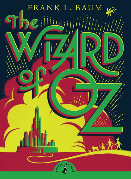The Wizard of Oz by Frank L. Baum book cover, depicting an illustration of the Emerald City surrounded in a cloud of yellow and orange. The title is atop the illustration in large green font, and a thin yellow link with silhouettes leads to the city on the bottom of the cover.