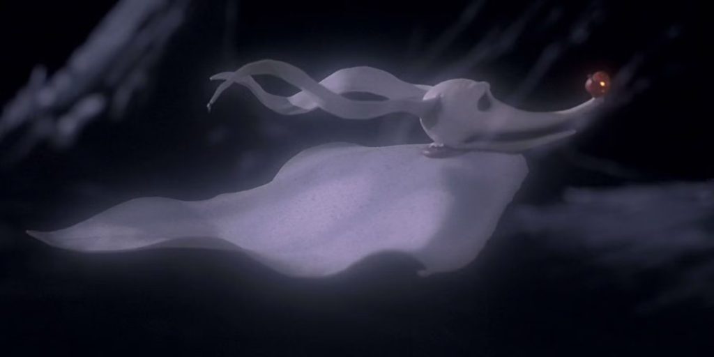 Still from The Nightmare Before Christmas, depicting Zero, a ghost dog made of a white sheet with a Jack-o'-lantern as a nose, flying. The background is dark.