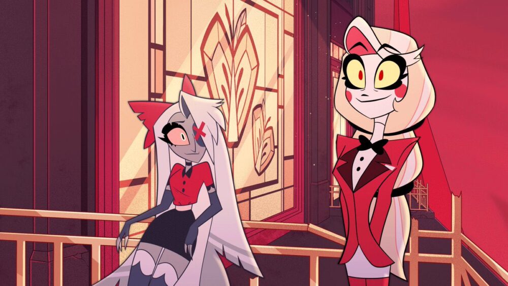 Still from Hazbin Hotel featuring Charlie standing tall with a smile on her face while Vaggie leans against a railing and looks at Charlie. The main colors are different variations of red and purple.