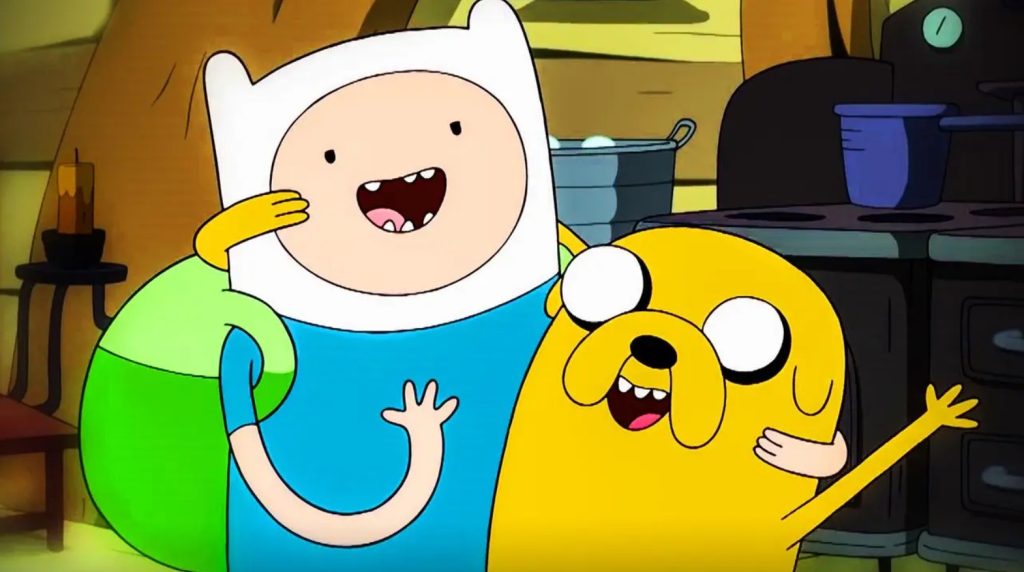 Finn and Jake smile as they place their arms around one another. The joy of their friendship radiates in the expressions on their faces.