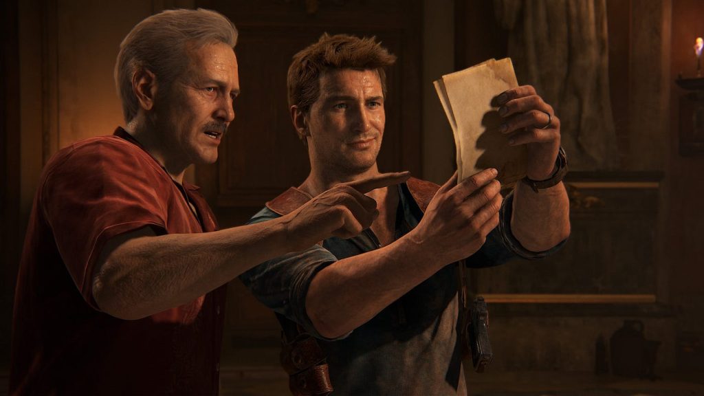 Nate and Sully analyse a map fragment. The warm fiery glow from the nearby torch illuminates their faces as well as the paper.