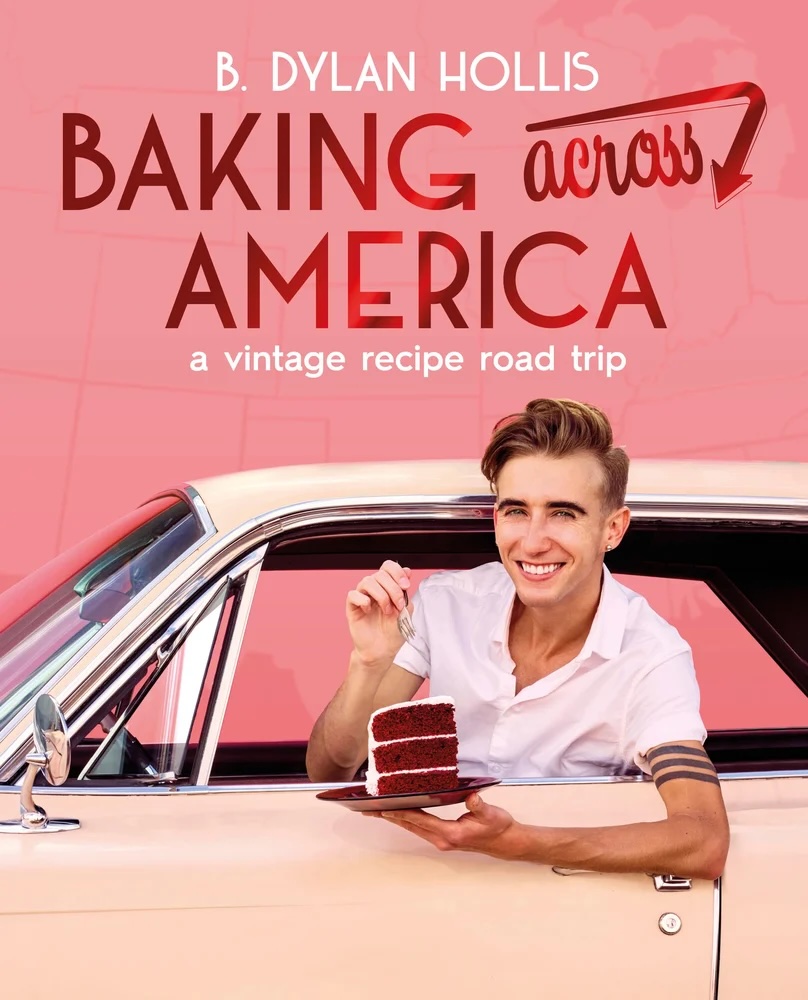 Baking Across America by B. Dylan Hollis book cover, depicting Hollis leaning out of a pink vintage car window with a piece of red velvet cake. The background is pink, and the title is at the top in red with an arrow on top of the word "across."