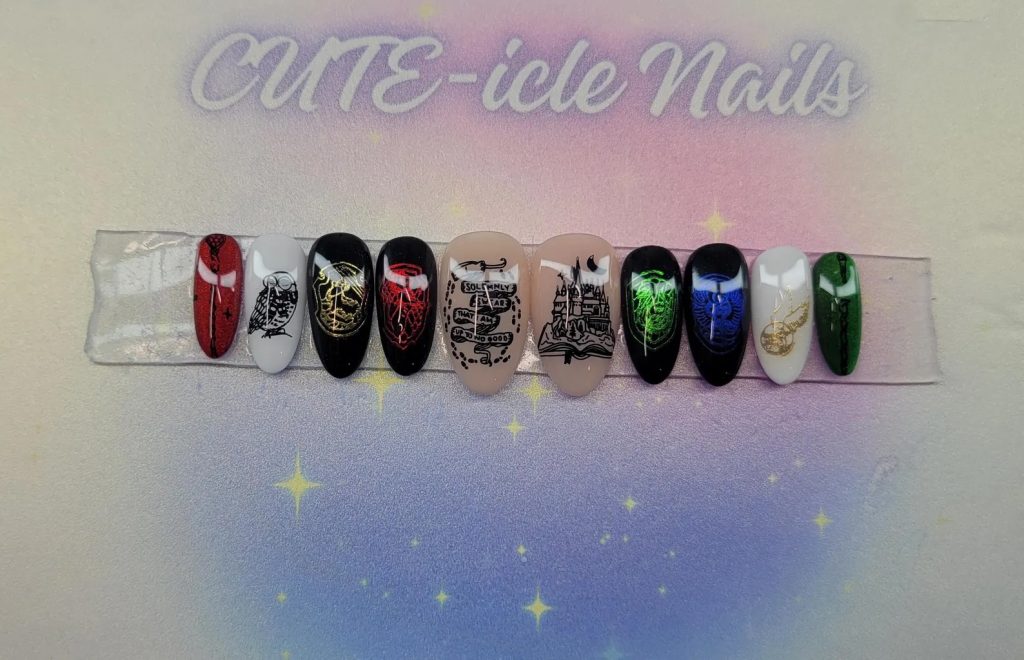 Set of press-on nails. Four nails have a black background with Harry Potter Hogwarts house emblems on them. Two nails have a white background with an owl and a golden snitch. Two nails have a beige background with the marauders map and a picture of Hogwarts. One nail is red with a wand, and the remaining nail is slightly cropped out but has a wand on a green background. The background of the picture has a gradient pink and blue circle and "CUTE-icle Nails" on top.