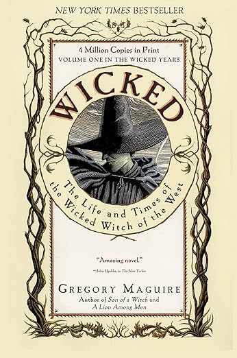 Wicked: The Life and Times of the Wicked Witch of the West by Gregory Maguire, depicting a white rectangle on a beige background with tree branches on the sides. There is a circle in the upper middle section with the title and an illustration of Elphaba, a witch in a black cloak and black hat.