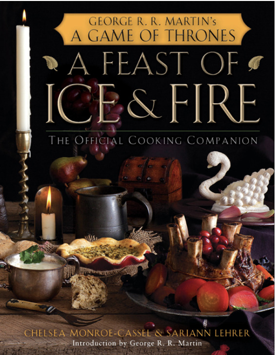 Cover of A Feast of Ice and Fire: The Official Cooking Companion for George R. R. Martin’s A Game of Thrones. Features a lavish medieval-style spread with pies, stews, fruit, and a swan-shaped pastry, surrounded by candles, goblets, and a treasure chest.