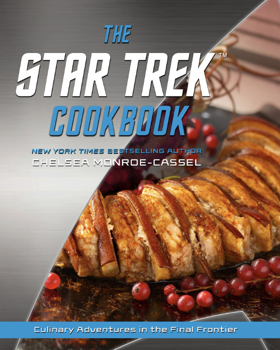 Cover of The Star Trek Cookbook by Chelsea Monroe-Cassel. The futuristic silver and blue design features a plated roast surrounded by cranberries, with the subtitle “Culinary Adventures in the Final Frontier.”