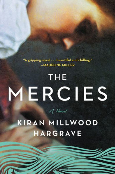 Book cover of "The Mercies" by Kiran Millwood Hargrave featuring a blurred image of a woman in prayer, with teal waves at the bottom.