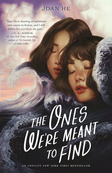 Book cover of "The Ones Were Meant To Find" by Joan He features two serene faces of young women, eyes closed, are surrounded by swirling ocean waves under a cloudy sky.
