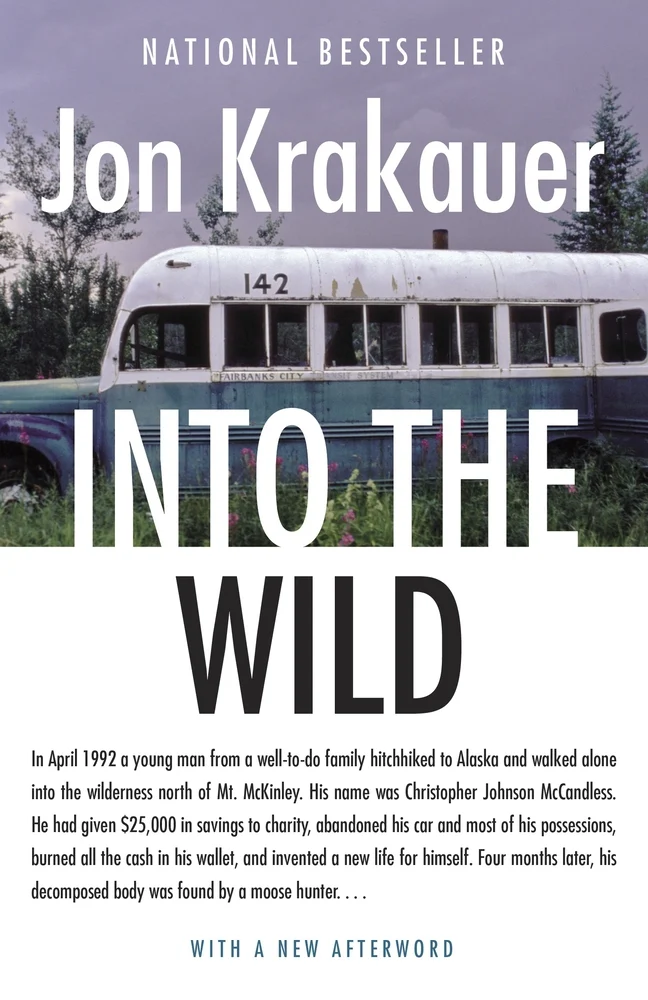 Into the Wild by Jon Krakauer book cover. Image depicts a photograph of a green and white bus in the wilderness.
