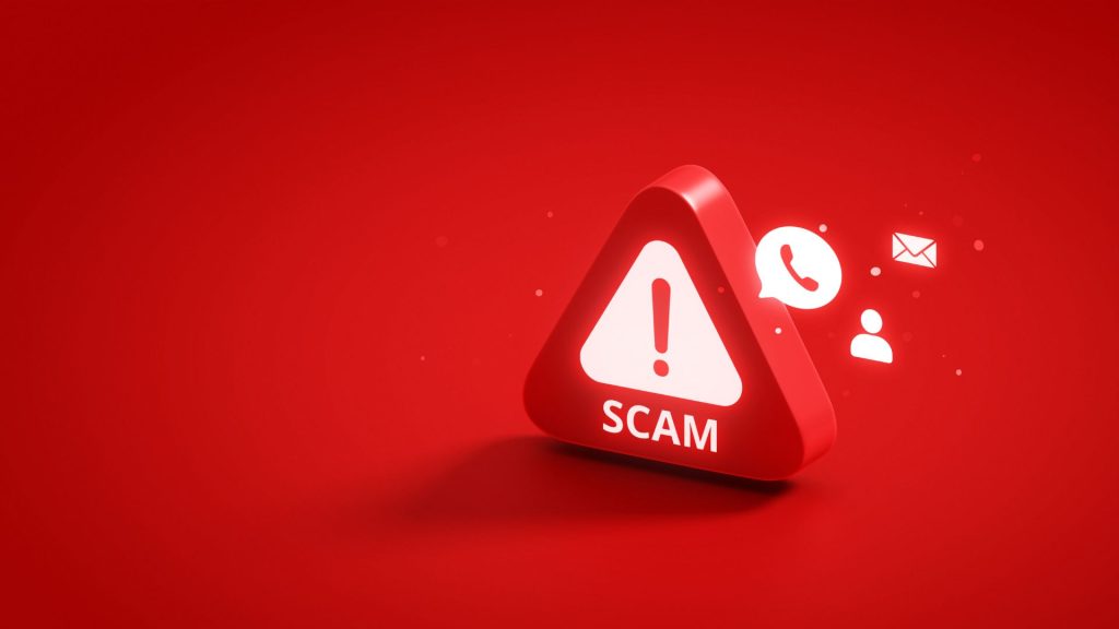 Red triangle with a warning light featuring an exclamation point and the word "SCAM" on a red background. Emanating from the triangle are lit up icons, including a speech bubble with a phone icon, a person's profile icon, and an envelope icon.