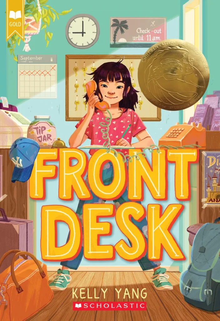 Front Desk by Kelly Yang, a middle-grade book cover depicting a girl answering the phone at a motel front desk with luggage and an award seal in the background.