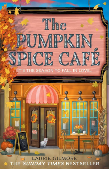 Book cover of "The Pumpkin Spice Cafe" by Laurie Gilmore. Autumn-themed café storefront with an orange facade, fall leaves, pumpkins, and a striped awning. A cat sits by the door, with festive signs and decor.
