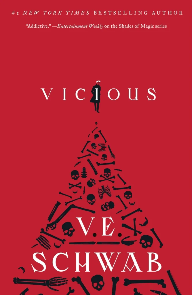 Vicious by V. E. Schwab, a dark fantasy novel featuring a red cover with a pyramid of black bones and skulls beneath the title, creating an ominous and intriguing tone.