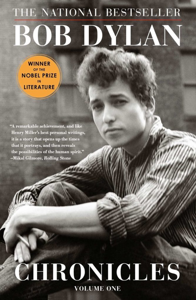Chronicles, memoir by singer/songwriter Bob Dylan book cover depicts Bob Dylan sitting with his hands around his knees, looking straight ahead in black and white.