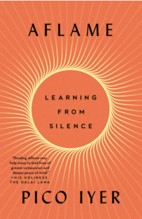 “Aflame: Learning from Silence” by Pico Iyer, an orange cover with concentric radiating lines forming a sun-like pattern, with black title text in the center and endorsement by the Dalai Lama.