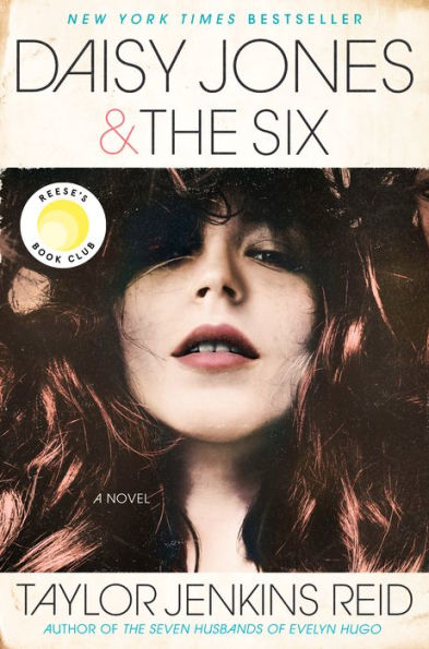 Book cover of "Daisy Jones & The Six" by Taylor Jenkins Reid. Features a woman's face with red hair, lips parted. Includes Reese's Book Club seal.
