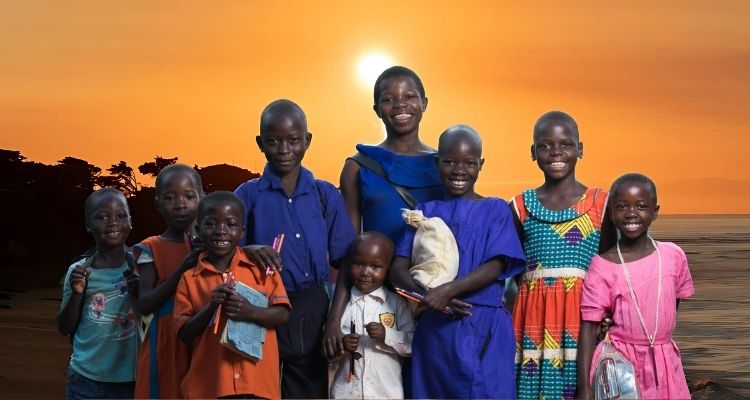 Group of Black children in colourful outfits, smiling and looking ahead against a background of a sunset.