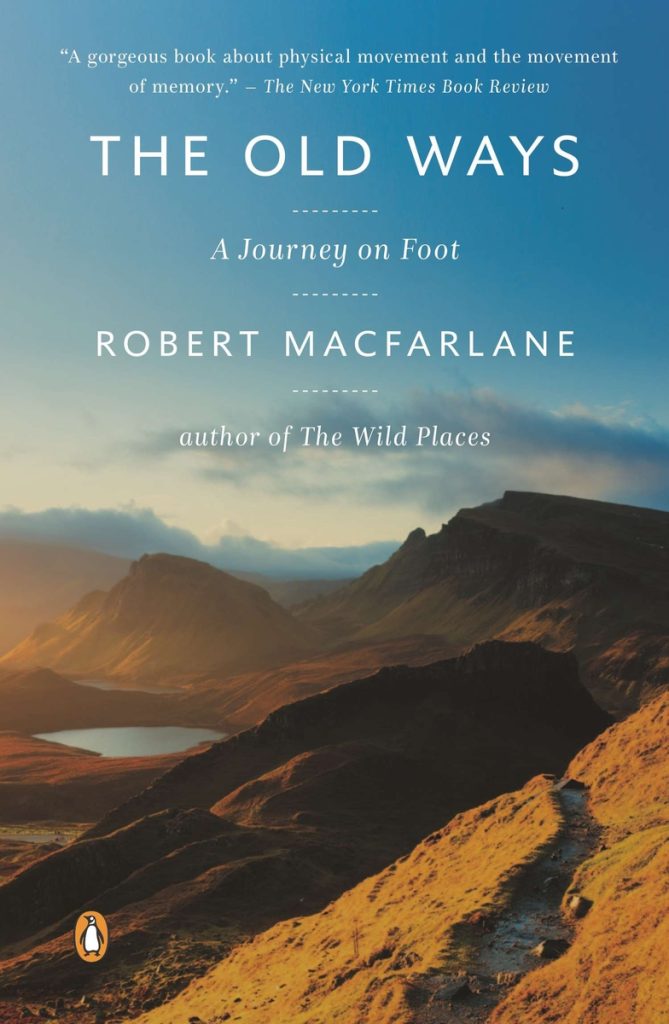 The Old Ways by Robert Macfarlane book cover depicts a mountainous landscape below a blue sky.
