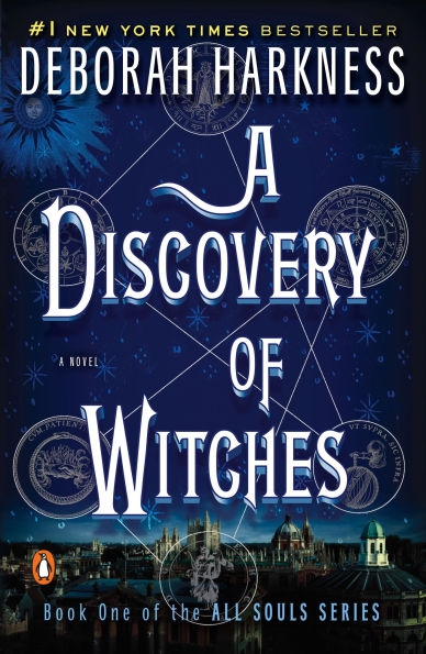 Book cover of "A Discovery of Witches" by Deborah Harkness. The dark blue background features celestial symbols and a luminous cityscape.