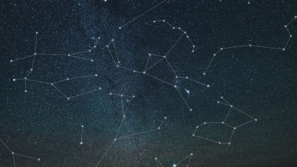 A starry night sky with constellations outlined in thin white lines.