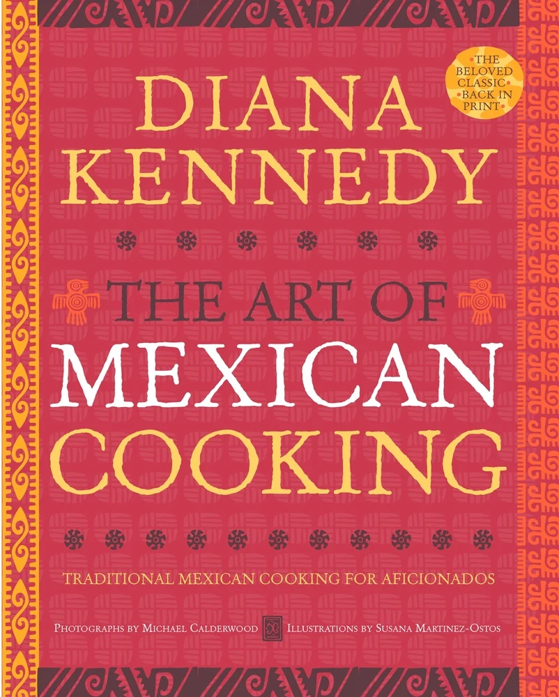 The Art of Mexican Cooking: Traditional Mexican Cooking for Aficionados by Diana Kennedy features a red cover with a border of lines and swirls and a sticker of "The beloved classic back in print."