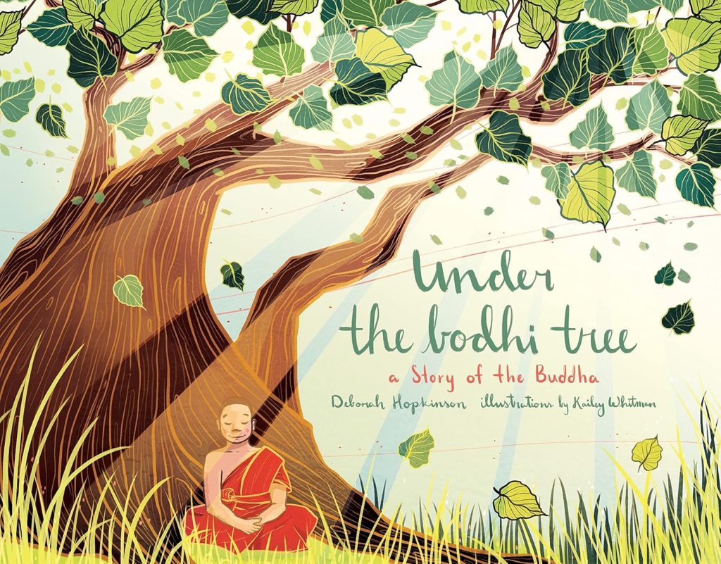 Under the Bodhi Tree: A Story of the Buddha by Deborah Hopkinson, illustrated by Kailey Whitman, features a large tree with falling leaves and Siddhartha Gautama (later known as the Buddha) sitting under the tree with light cast across them and the lighting up of the title under the tree branches.