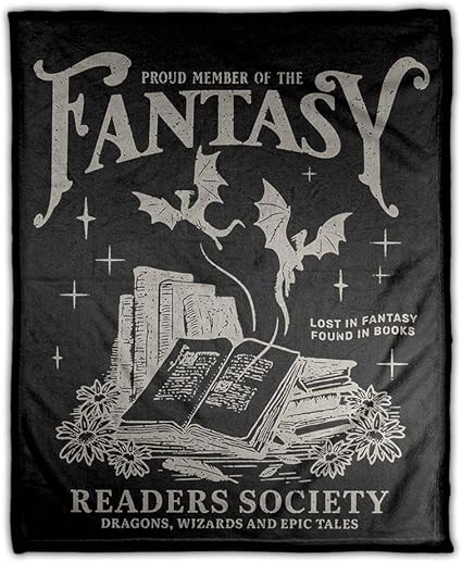 The image features a black blanket with the words "Proud Member of the Fantasy Readers Society" at the top, with a pile of books and dragons flying out of them. On the side of the blanket is "Lost in Fantasy Found In Books" with stars on both sides.