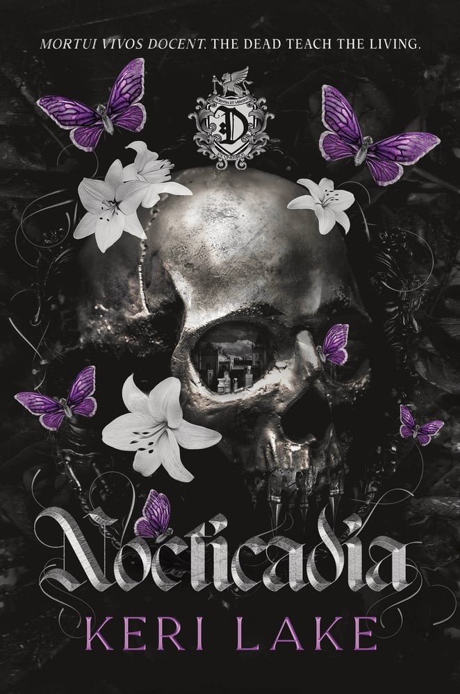 A metallic skull centered on a dark background, adorned with white flowers and purple butterflies. Text reads "The Dead Teach the Living" and "Nocticadia" by Keri Lake, giving a gothic and mysterious tone