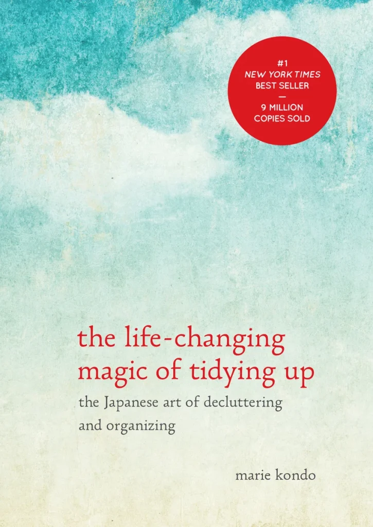 The Life-Changing Magic of Tidying Up by Marie Kondo, a self-help book cover depicting a gradient blue and green background with the title in red text.