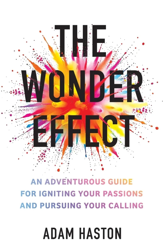 The Wonder Effect by Adam Haston, a self help book cover depicting a white background with an explosion of red, pink, and yellow in the center.