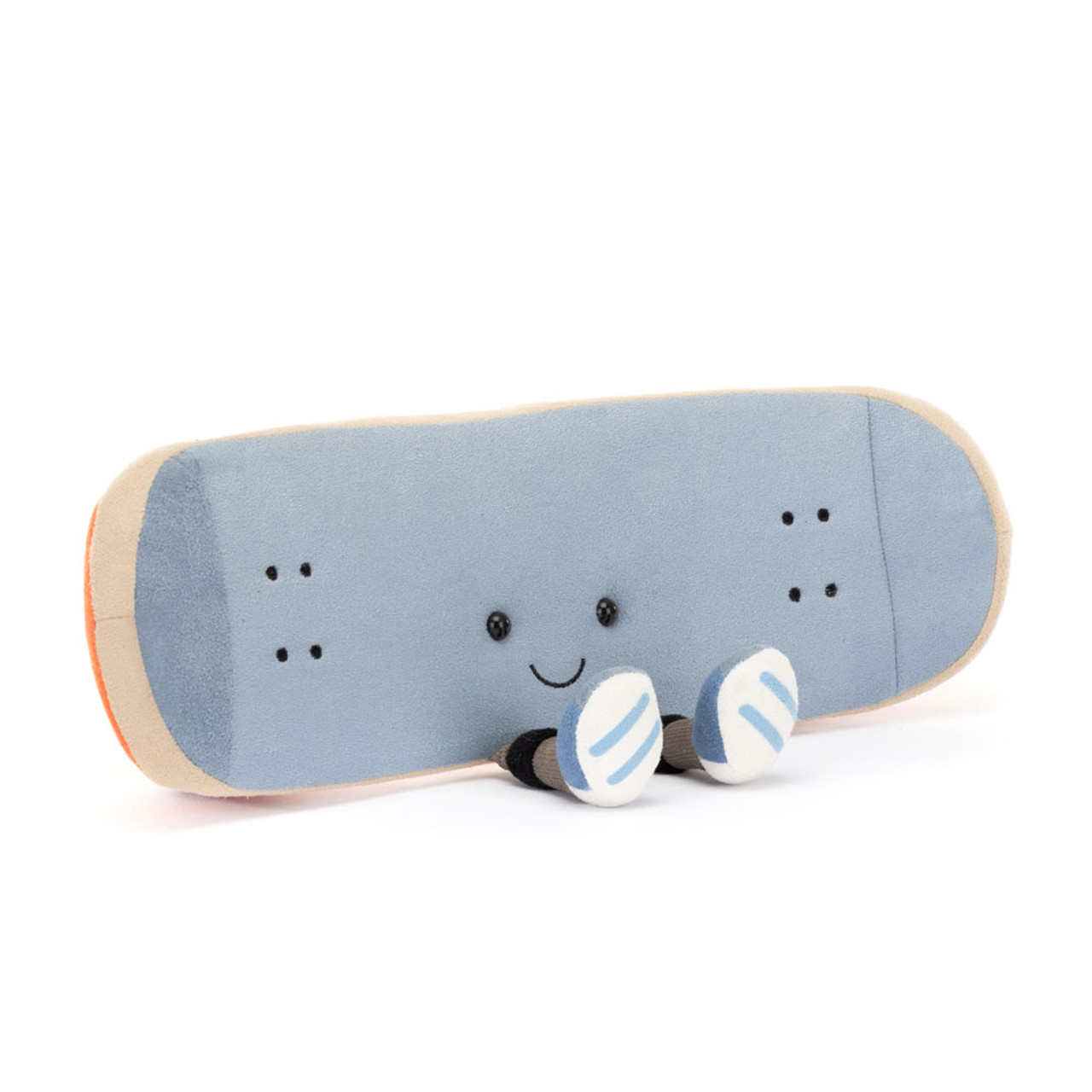 Cute skateboard plush toy with a smiling face. It has a blue top, beige sides, white wheels, and small black eyes