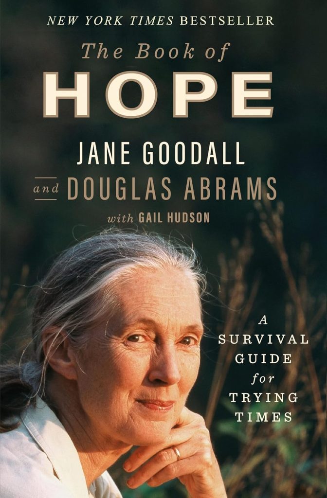 The Book of Hope by environmentalist Jane Goodall with Douglas Abrams and Gail Hudson book cover. Depicts Jane Goodall, an older White woman, smiling in the forest.