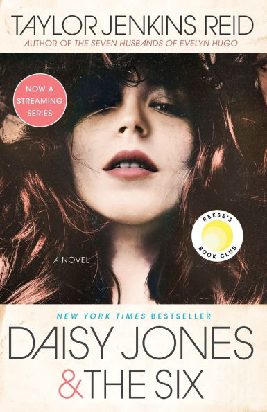 Book cover of "Daisy Jones & The Six" by Taylor Jenkins Reid features a close-up of a woman with long, wavy hair. It includes "Reese's Book Club" and "Now a Streaming Series" badges.