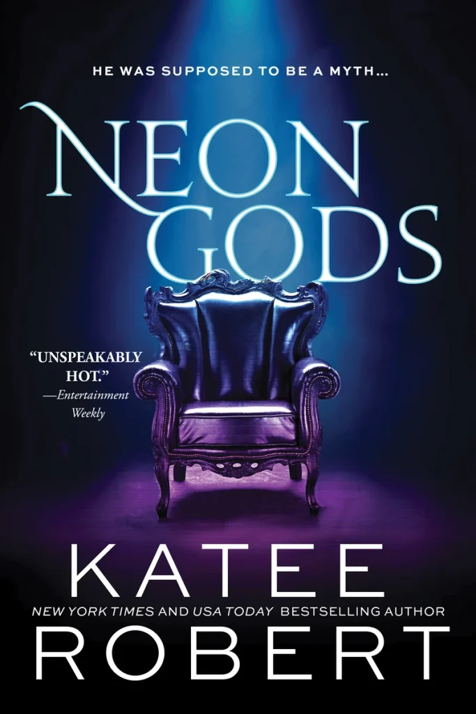 "Neon Gods" by Katee Robert, a dark romance book cover featuring a glowing ornate black chair illuminated by blue light, with the tagline “He was supposed to be a myth…” and a review quote in white text.