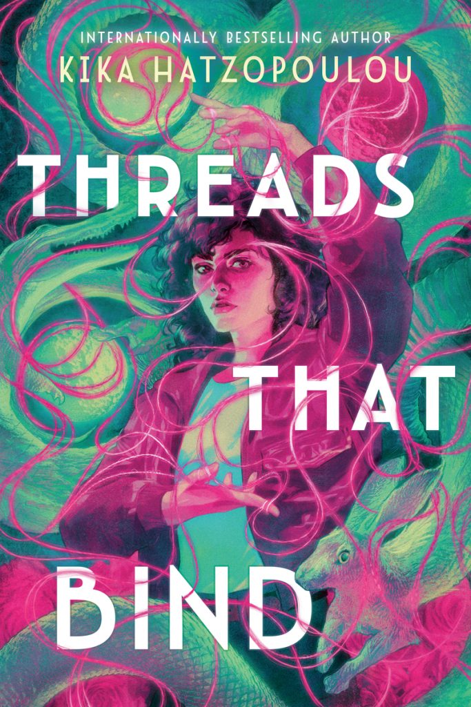 "Threads That Bind" by Kika Hatzopoulou, a YA fantasy book cover featuring a girl with curly hair standing amid swirling pink and teal threads with a serpent below.