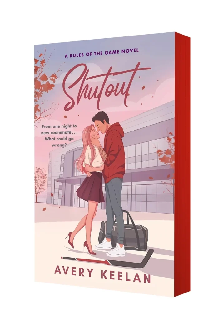 Shutout by Avery Keelan, a college romance book cover featuring a young couple embracing in front of a modern building with autumn leaves falling around them, creating a warm atmosphere.