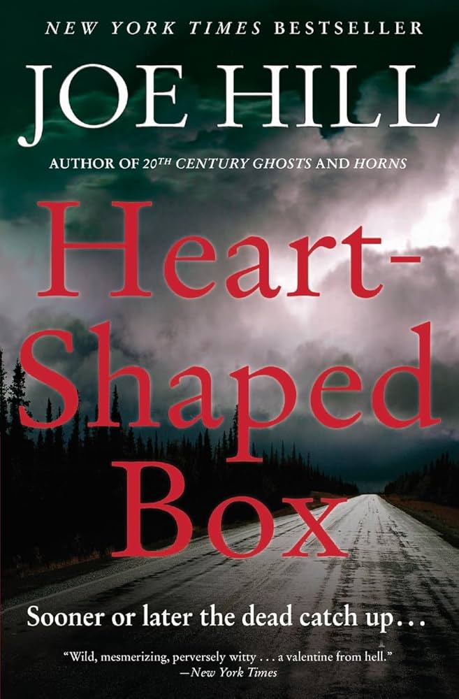 Heart-shaped box by Joe Hill, featuring an isolated road and a cloudy sky.