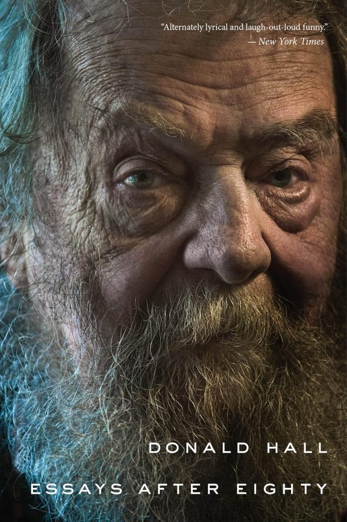 Essays After Eighty by Donald Hall, a memoir cover depicting Hall looking at the camera. He has wrinkled fair skin, greenish eyes, and a gray-blond beard.