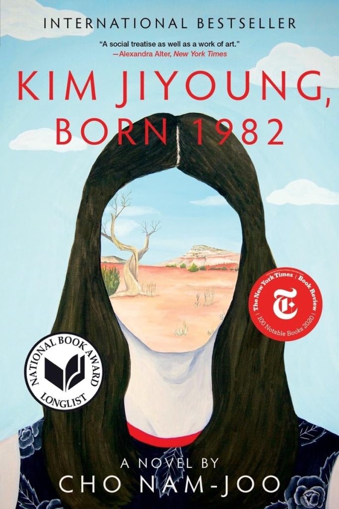 Kim Jiyoung, Born 1982 by Cho Nam-joo, a fiction novel cover showing an illustrated woman with long dark brown hair, a red, white and blue top, and a face filled in by the image of a dry landscape with a bare tree and a few shrubs. The background behind the woman is a blue sky with a few white clouds.